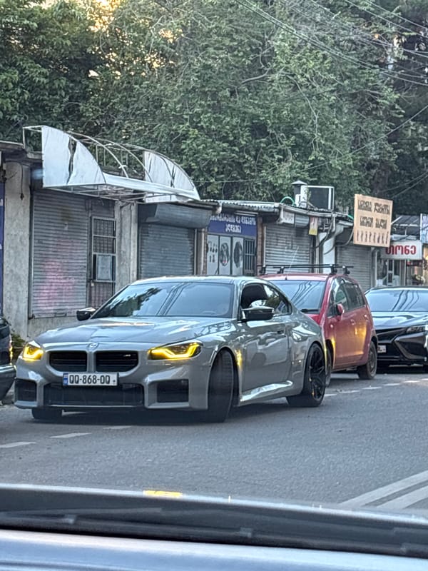 Afternoon street life documented across Tbilisi neighborhoods