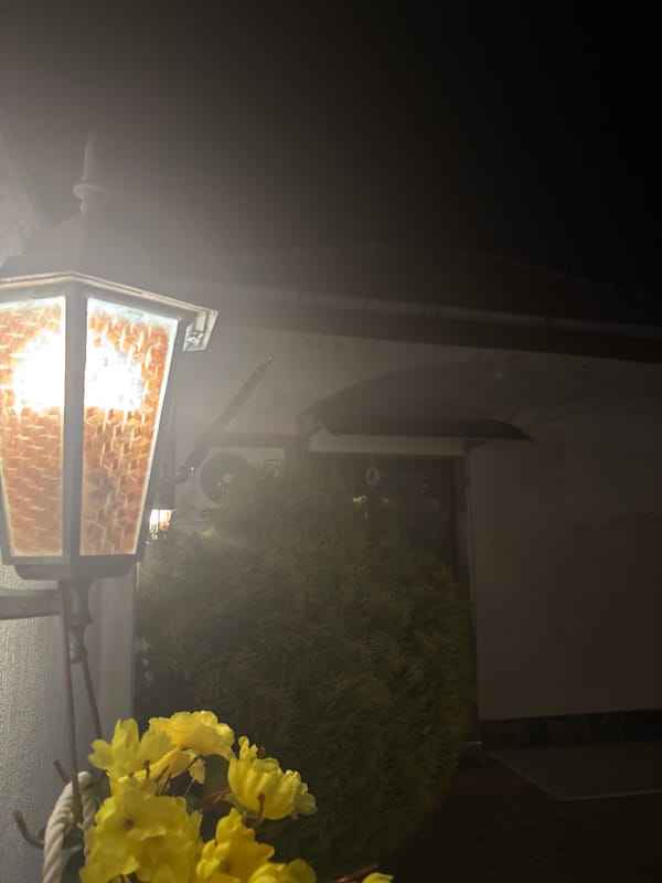 Nighttime street photography captures illuminated fixtures in Lom, Bulgaria