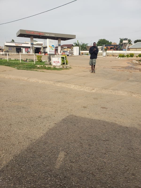 Morning street life documented around African gas station