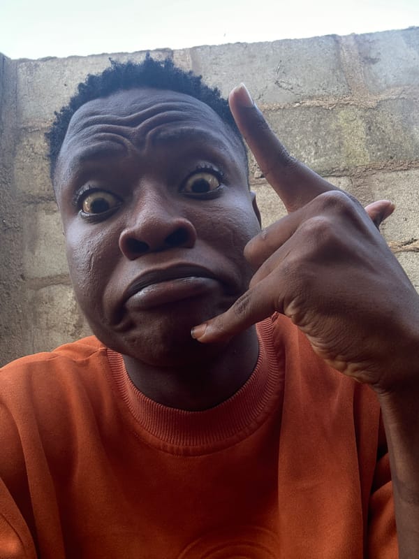 Afternoon selfie session in Ikorodu, orange sweatshirt, many moods
