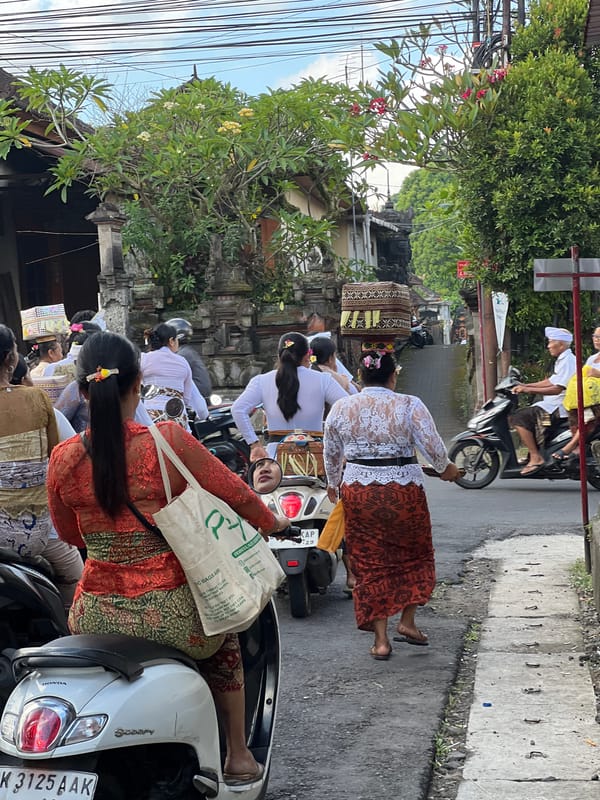 Balinese Hindus carry offerings to temple ceremony in Singakerta