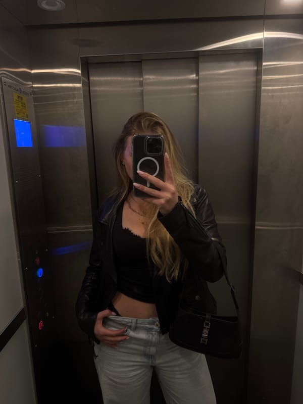 Woman in black jacket observed in elevator, car in Tel Aviv