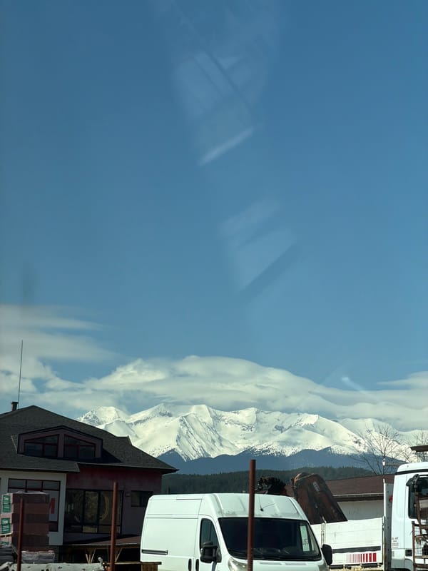 Spring morning view of snow-capped mountains in Kraishte, Bulgaria