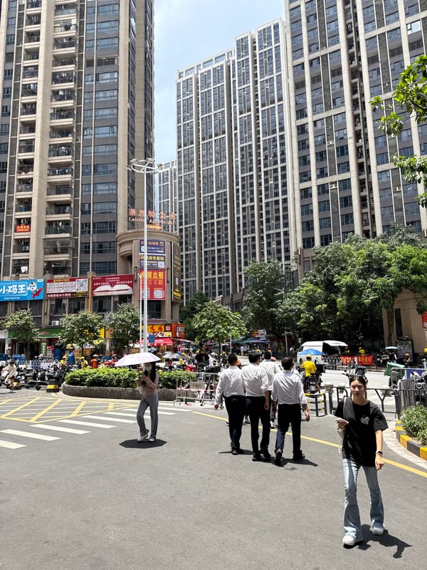 Haizhu District street life: scooters, bakeries, and mall retail
