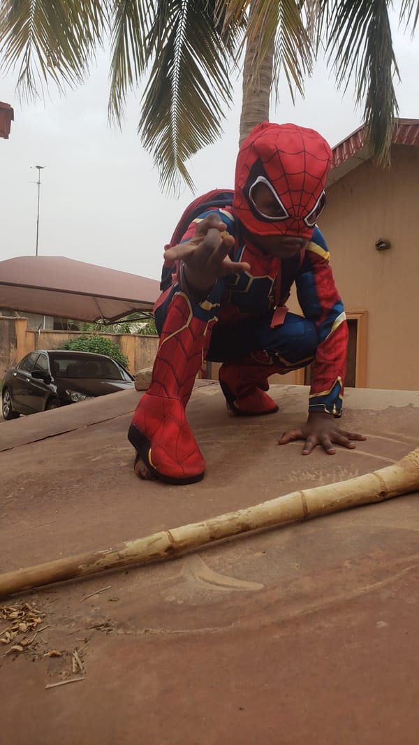 Child in Spider-Man costume photographed across Kaduna neighborhoods