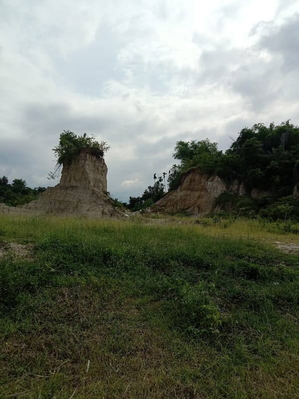 Eroded rock formations and domed building observed in Seuneubok