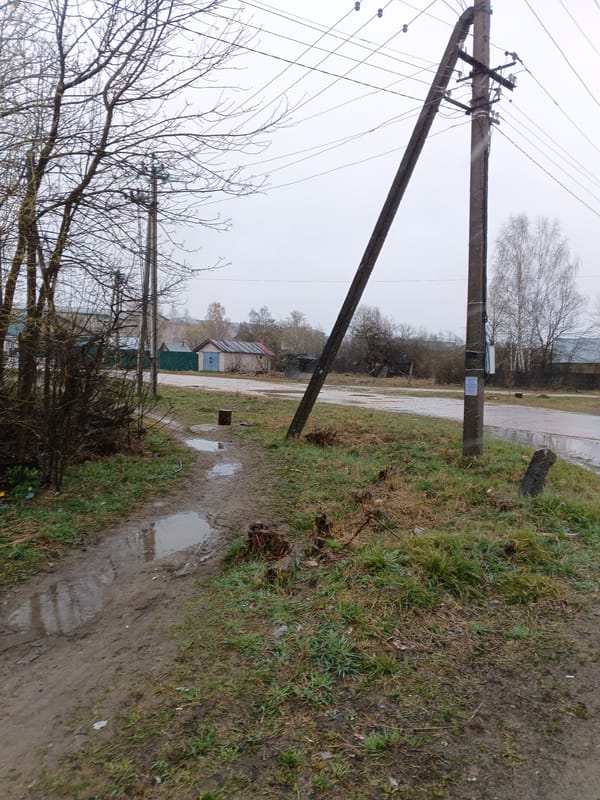 Rural Russian village life documented during overcast spring morning