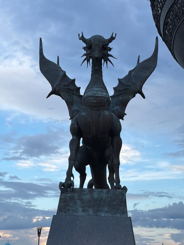 Kazan's dragon statues and landmark architecture on a June afternoon
