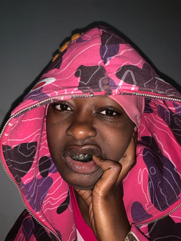 Person spotted in pink camouflage hoodie with head covering