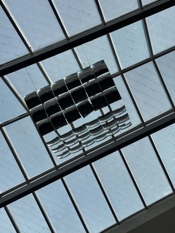 Travelers document Zurich Airport's distinctive geometric ceiling architecture