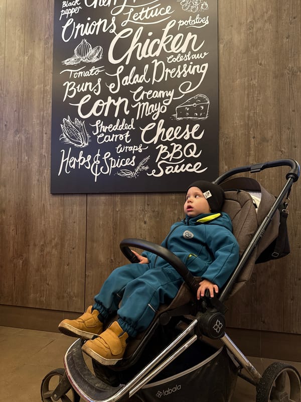 Family dining at Russian fast-food restaurant with toddler
