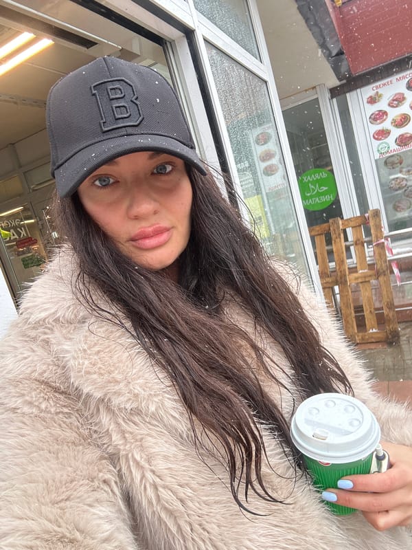 Woman with coffee cup spotted outside Moscow building