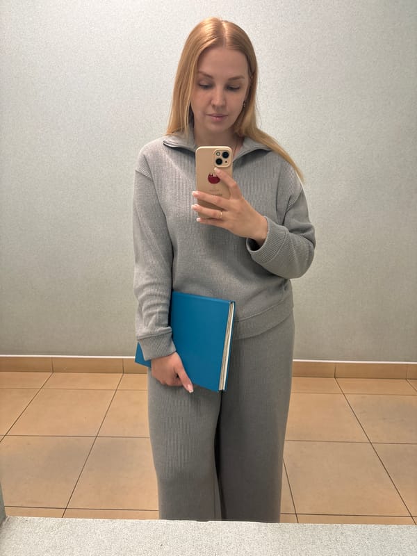 Woman takes selfies with blue book in Rusanovo facility