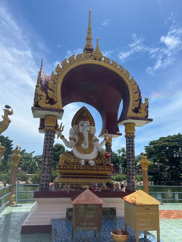 Visitor documents Hindu-Buddhist temple statues and architecture in Thailand