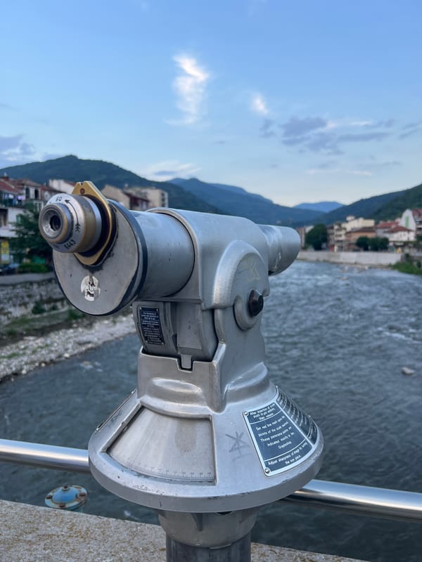 Tourist with mint green BMW explores Asenovgrad riverside
