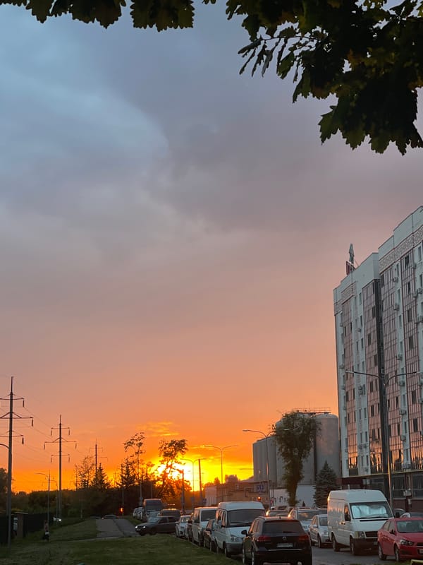 Vibrant sunset illuminates Rozsoshentsi, Ukraine street scene
