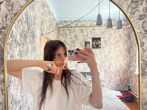 Mirror selfies with gold under-eye patches, Blizhnii Khutor bedroom