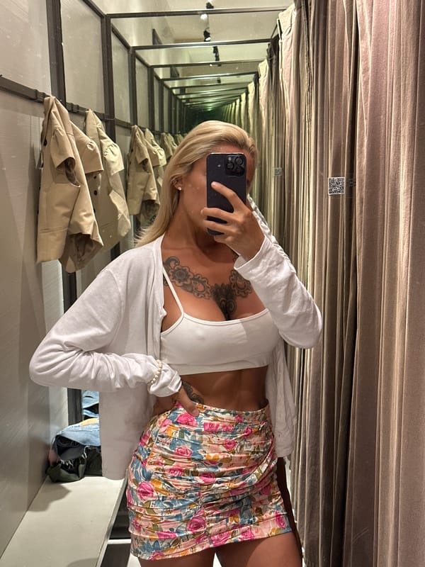 Trying on outfits in Kuta, with a Barong mask sighting nearby