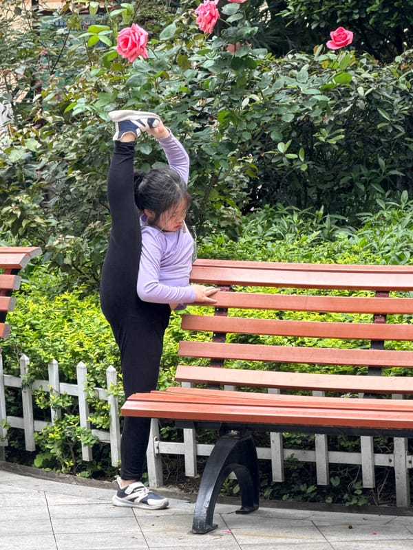 Woman performs morning stretches in Yuzhong District park