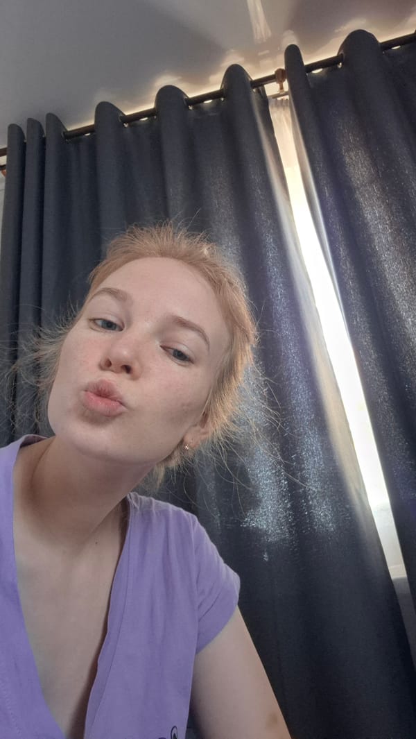 Woman poses for camera in indoor setting in Russia