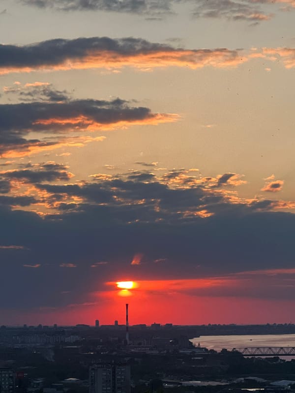 Dramatic sunset illuminates Belgrade skyline and river