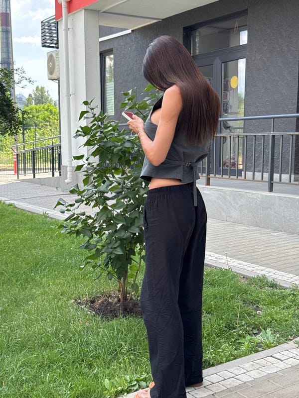 Selfies outside a modern building on a sunny day