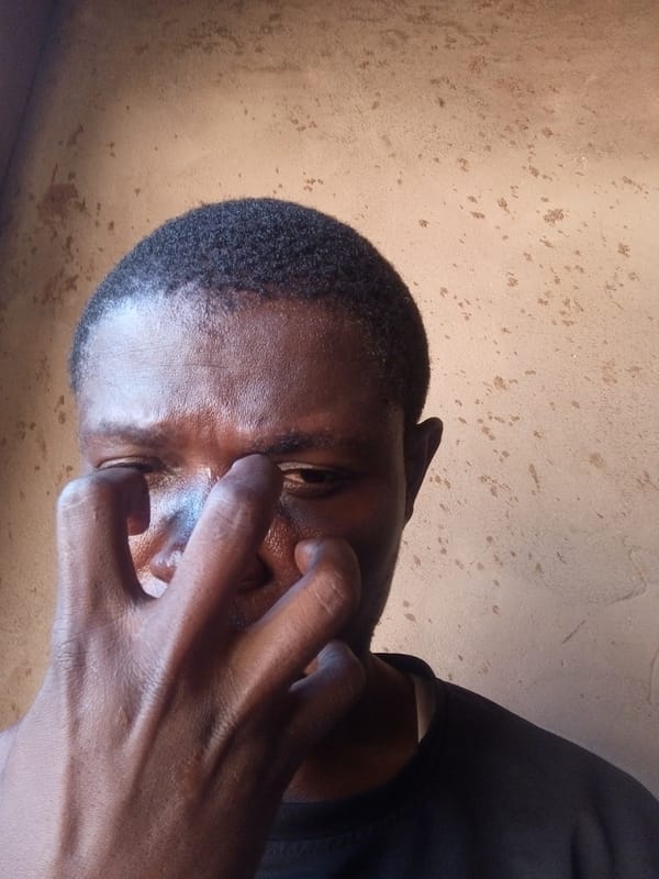 Idle indoor moment on a tiled floor in Gombe, Nigeria