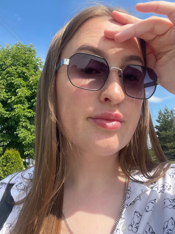 Woman takes sunny outdoor selfies in Сырково, Russia