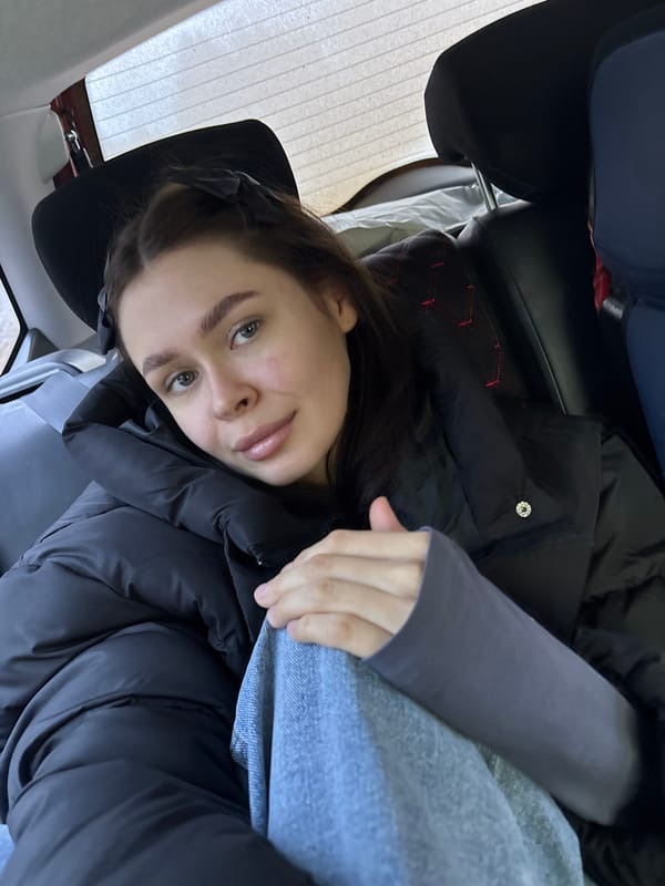 Woman reclining in car seat observed in Dubrova, Russia