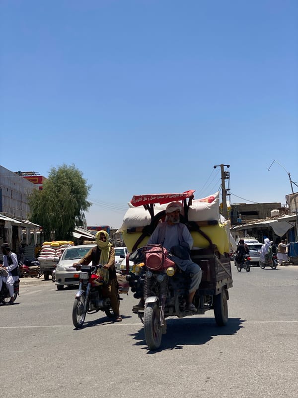 Three-wheeled cargo bike carries goods through Kandahar streets