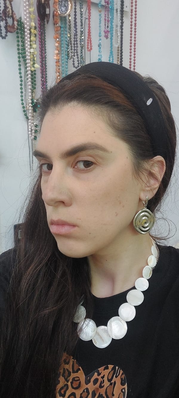 Woman shops for jewelry accessories in Novosibirsk store