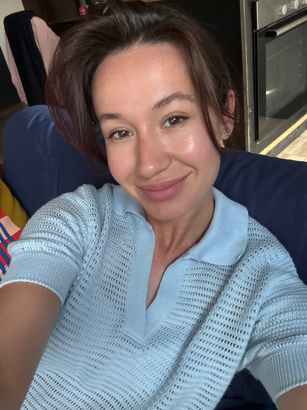 Woman photographed smiling indoors in Tel Aviv apartment