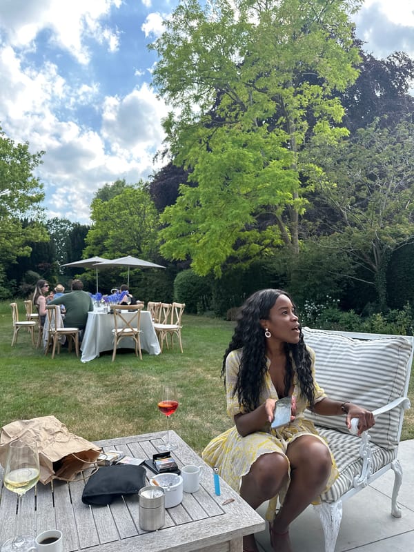 Casual outdoor social gathering documented in Cambridge backyard