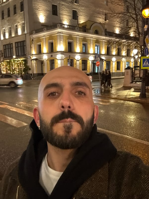 Man takes nighttime selfie on wet Moscow crosswalk