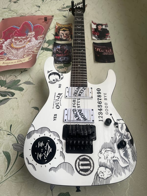 Guitars, sleeping cat, and cloudy skies captured in home