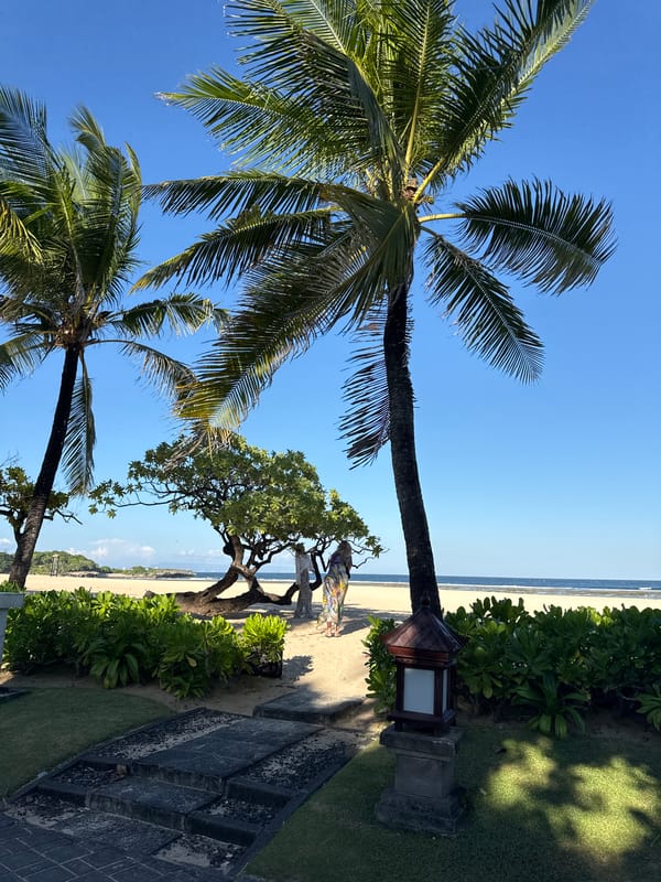 Sunny morning beach activities captured in Kuta Selatan, Indonesia
