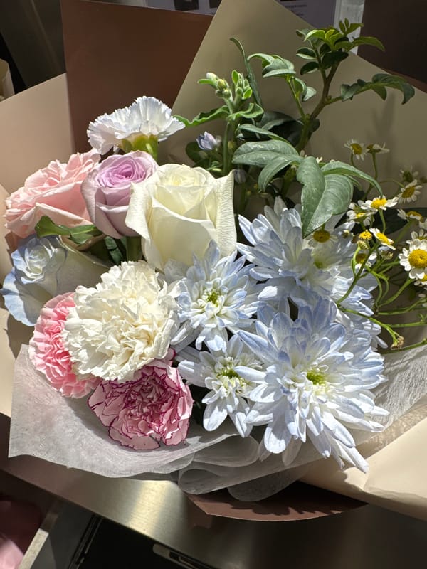 Kuala Lumpur florist displays fresh bouquets on a Sunday morning