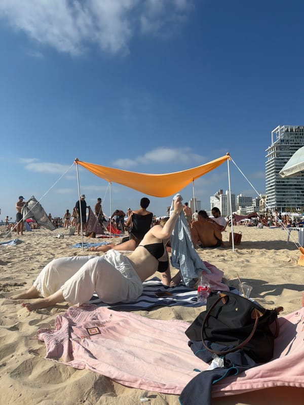 Sun, selfies, and flowers on a Tel Aviv beach afternoon