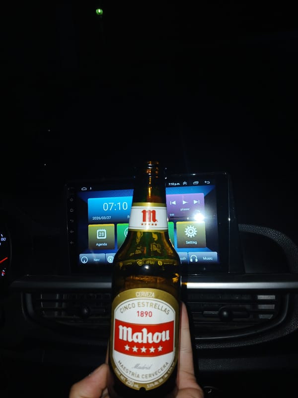 Person holds beer bottle in vehicle in Meknes