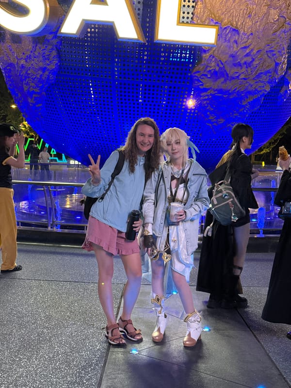 Tourists gather at Universal Studios globe in Beijing
