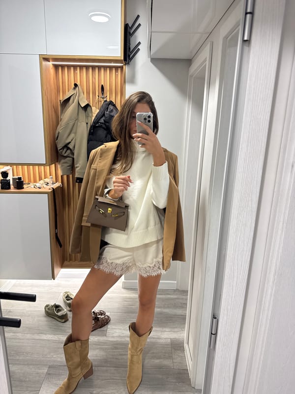 Mirror selfie in a Burgas hallway, camel blazer and cowboy boots