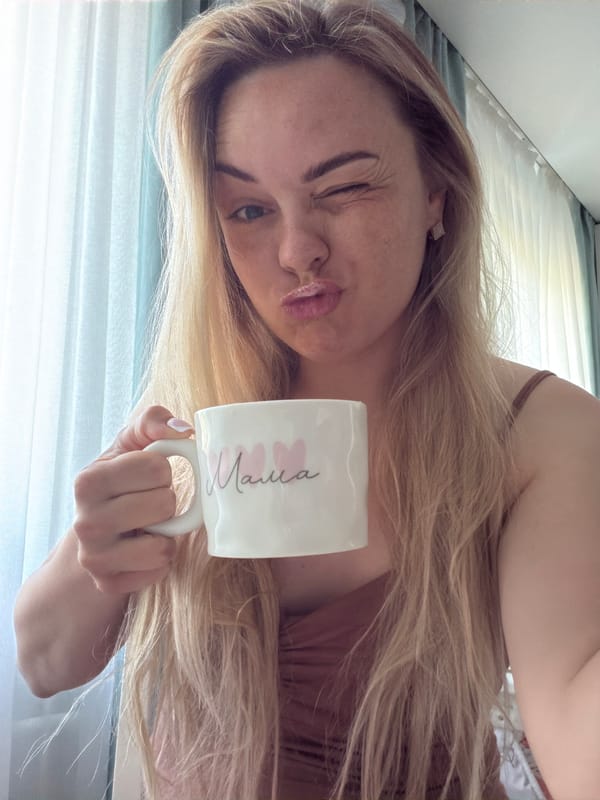 Woman poses with 'Mama' mug in Votkinsk home