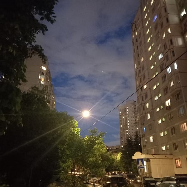 Moscow residents document quiet evening scenes around illuminated apartments
