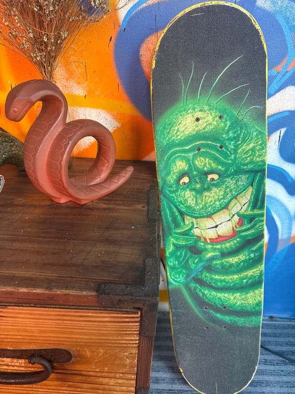 Skateboard and patterned furniture details in a casual interior setting