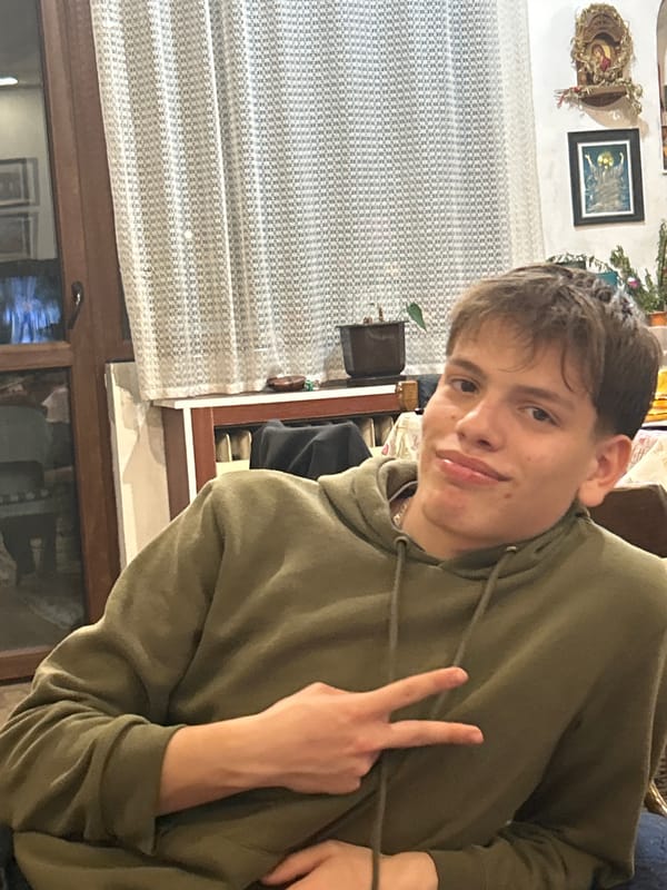 Young man photographed twice indoors in Panagyurishte, Bulgaria