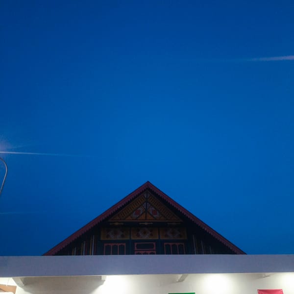 Dusk to night at a mosque and roadside stop in Aceh
