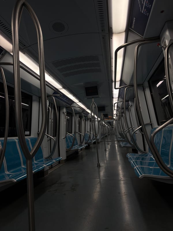 Nearly empty Rome Metro car observed during evening hours