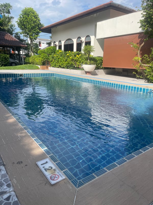 Poolside property in Ratsada with motorcycle and garden flowers