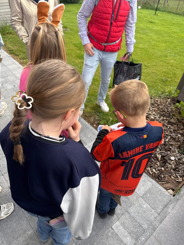 Children gather on patio in Marche-en-Famenne, Belgium