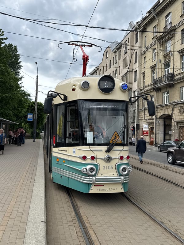 Tram 3105 stops near Saint Petersburg Mosque under overcast skies